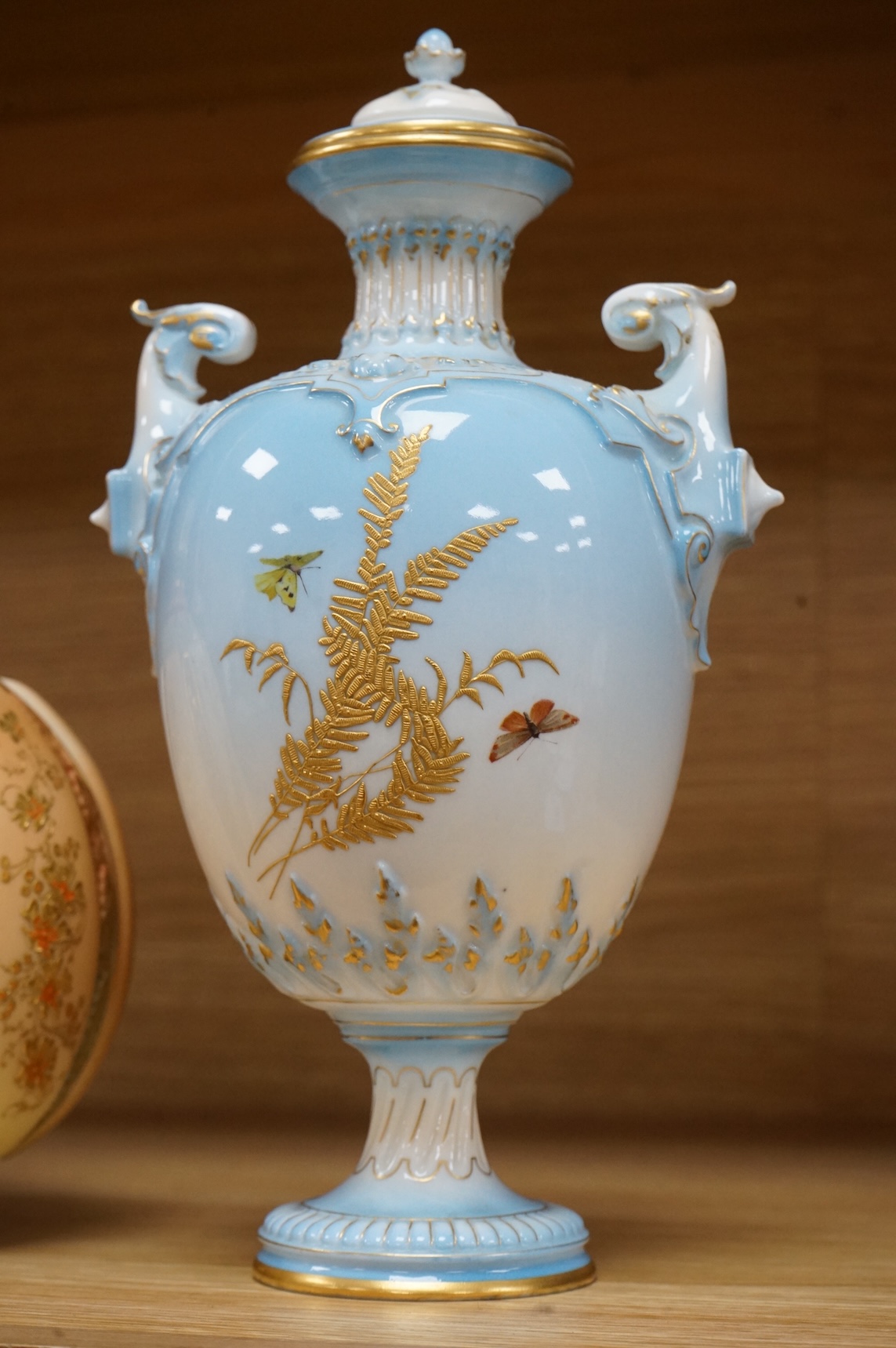 A Royal Worcester vase and cover, shape 1618 decorated with ferns and insects, a similar blush ivory bottle vase and a pot pourri vase and cover decorated with roses, tallest 24cm